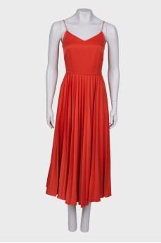 Помаранчева сукня з плісированою спідницею