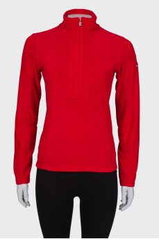 Червоний светр з блискавкою біля коміра