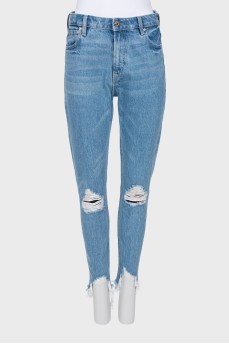 Блакитні джинси з ефектом рваних