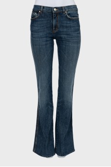 Розкльошені джинси темно-синього кольору
