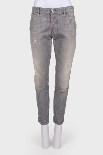 Сірі джинси з ефектом порваних та потертих