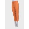 Оранжевые брюки прямого кроя
