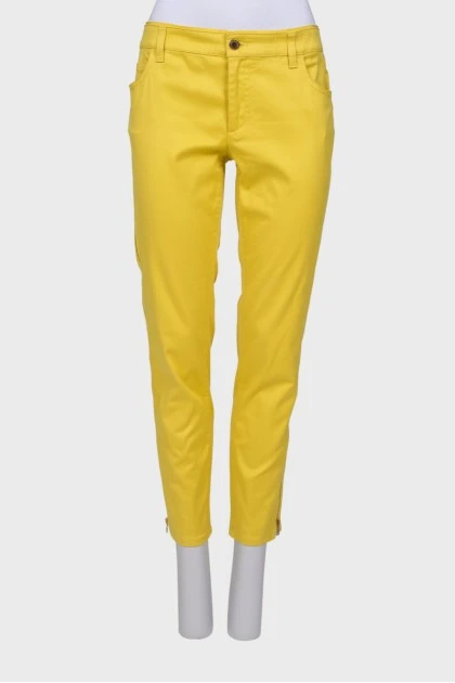 Желтые джинсы с молнией по бокам