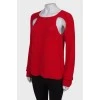 Червоний светр із розрізами