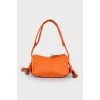 Кожаная оранжевая сумка с кисточками