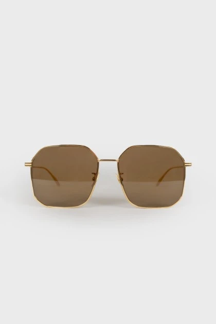 Золотистые солнцезащитные очки 