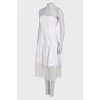 Біла сукня з плісированим подолом