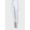 Белые джинсы с декором снизу