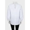 Біла блузка декорована мереживом