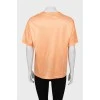 Оранжевая футболка с рельефными швами