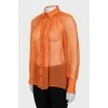 Напівпрозора блузка оранжевого кольору