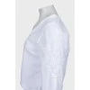 Біла блузка декорована вишивкою