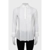 Прозрачная блуза с оборками на манжетах