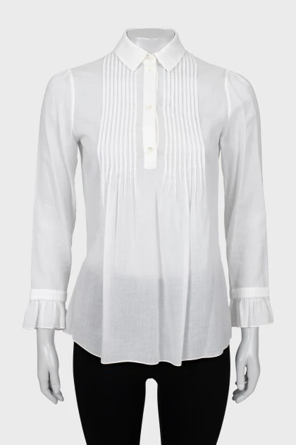 Прозрачная блуза с оборками на манжетах