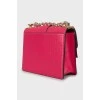 Рожева сумка декорована шипами