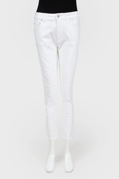 Білі розкльошені джинси