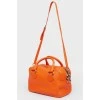 Ярко-оранжевая кожаная сумка на молнии