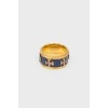 Золотистое кольцо с вставкой синего цвета