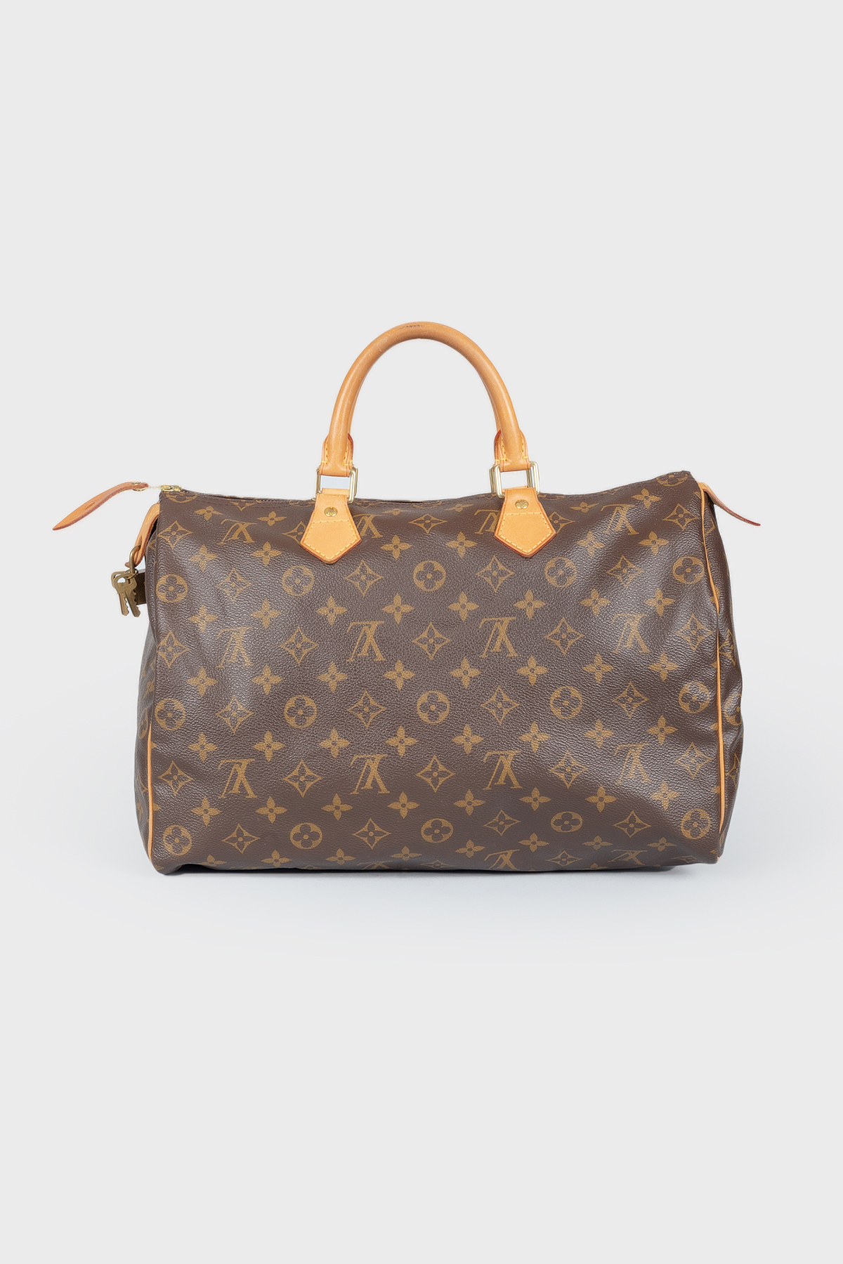 

Коричневая кожаная сумка Speedy с фирменной расцветкой бренда Louis Vuitton, Коричневый